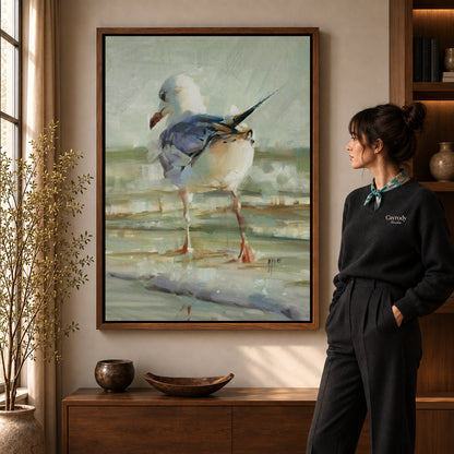 Seagull Canvas Art in a walnut frame beside a standing woman and warm wooden furniture.
