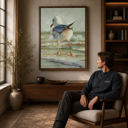 Seagull Canvas Art displayed in a walnut frame above wooden furniture beside a seated man.