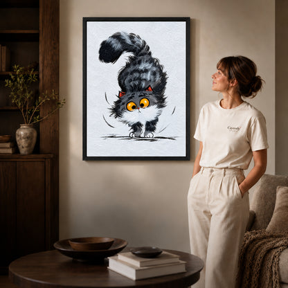 Black framed kitten canvas wall art displayed beside a woman with natural light across the wall.