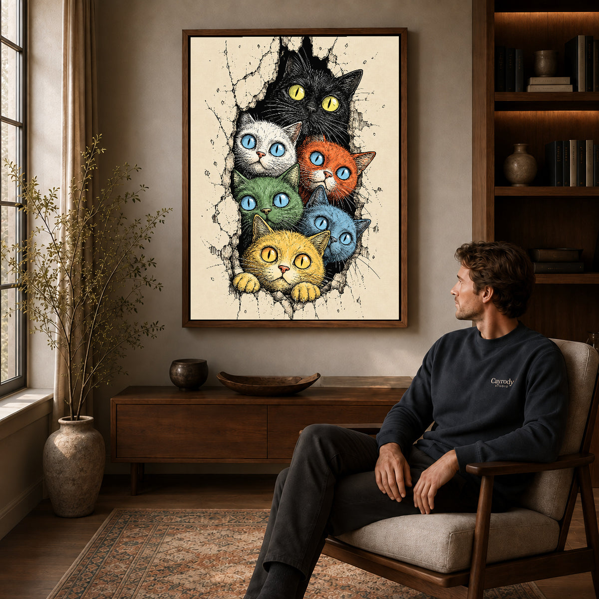 Colorful Cat Canvas Art displayed in a walnut frame above wooden furniture beside a seated man.