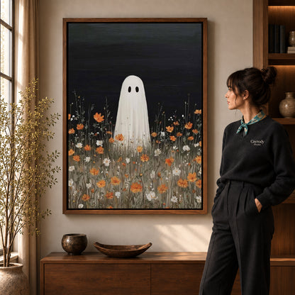 Ghost Canvas Wall Art in a walnut frame beside a standing woman and warm wooden furniture.