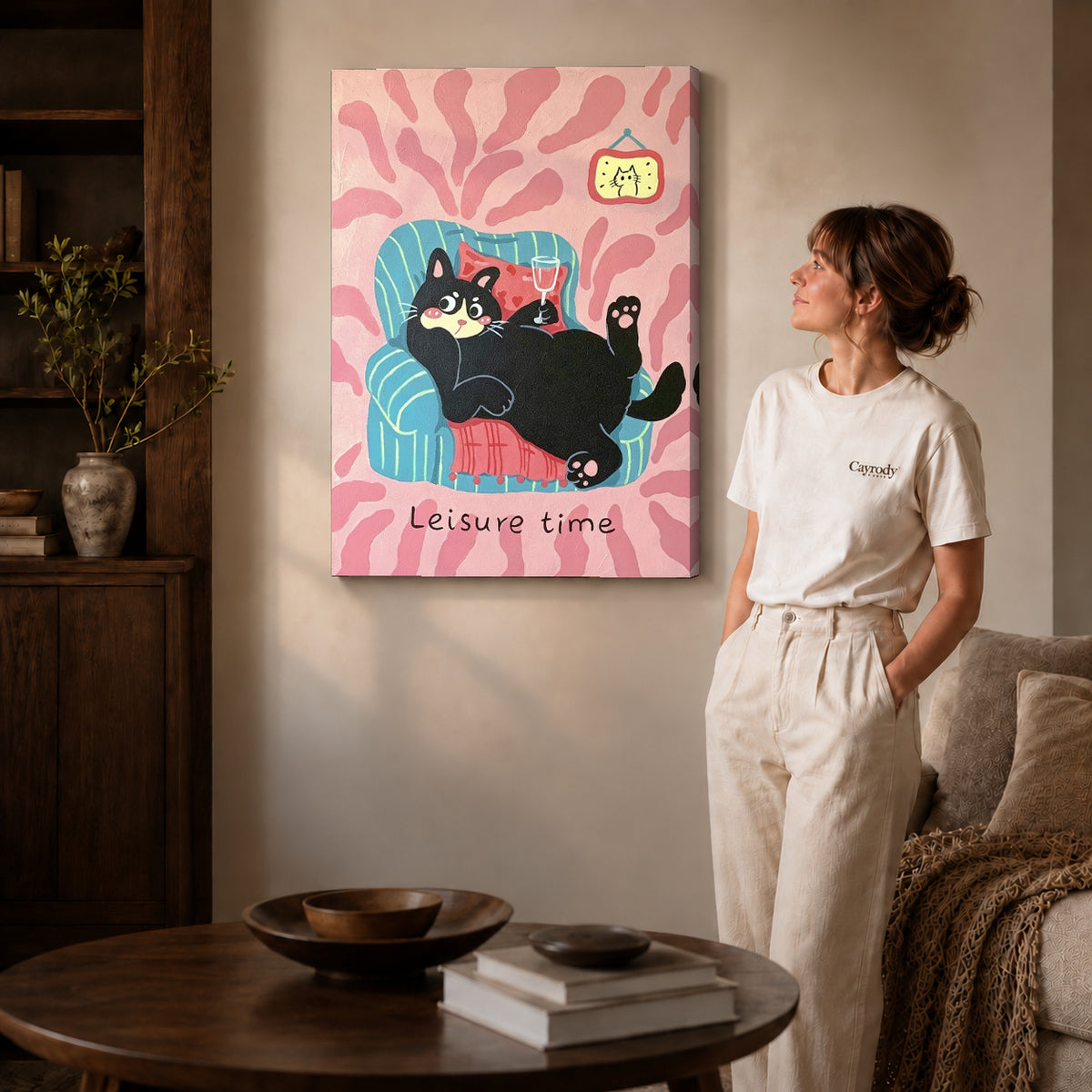 Relaxing Cat Canvas Art on gallery wrapped canvas with visible depth beside a woman in white.