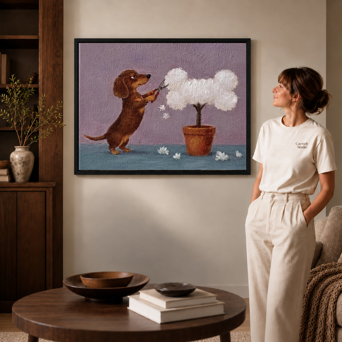 Dachshund Canvas Wall Art inside a black frame in a softly lit living room with books.