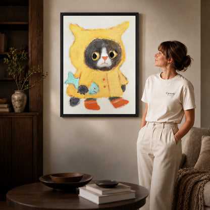 Black framed raincoat cat canvas art displayed beside a woman with natural light across the wall.