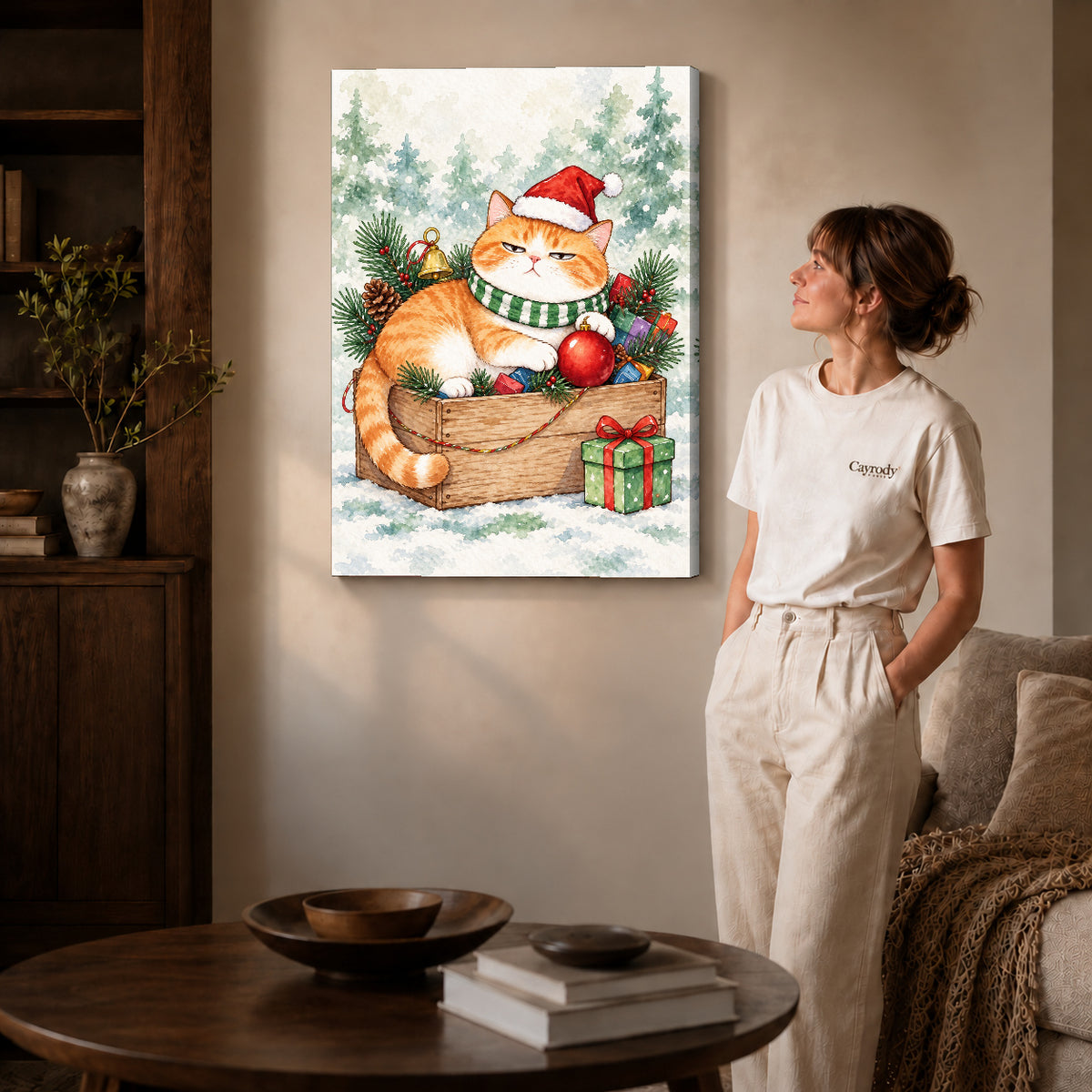 Christmas Cat Canvas Art on gallery wrapped canvas with visible depth beside a woman in white.