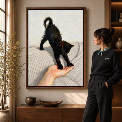 Walnut framed black kitten canvas art with the complete artwork displayed in a warm living room.