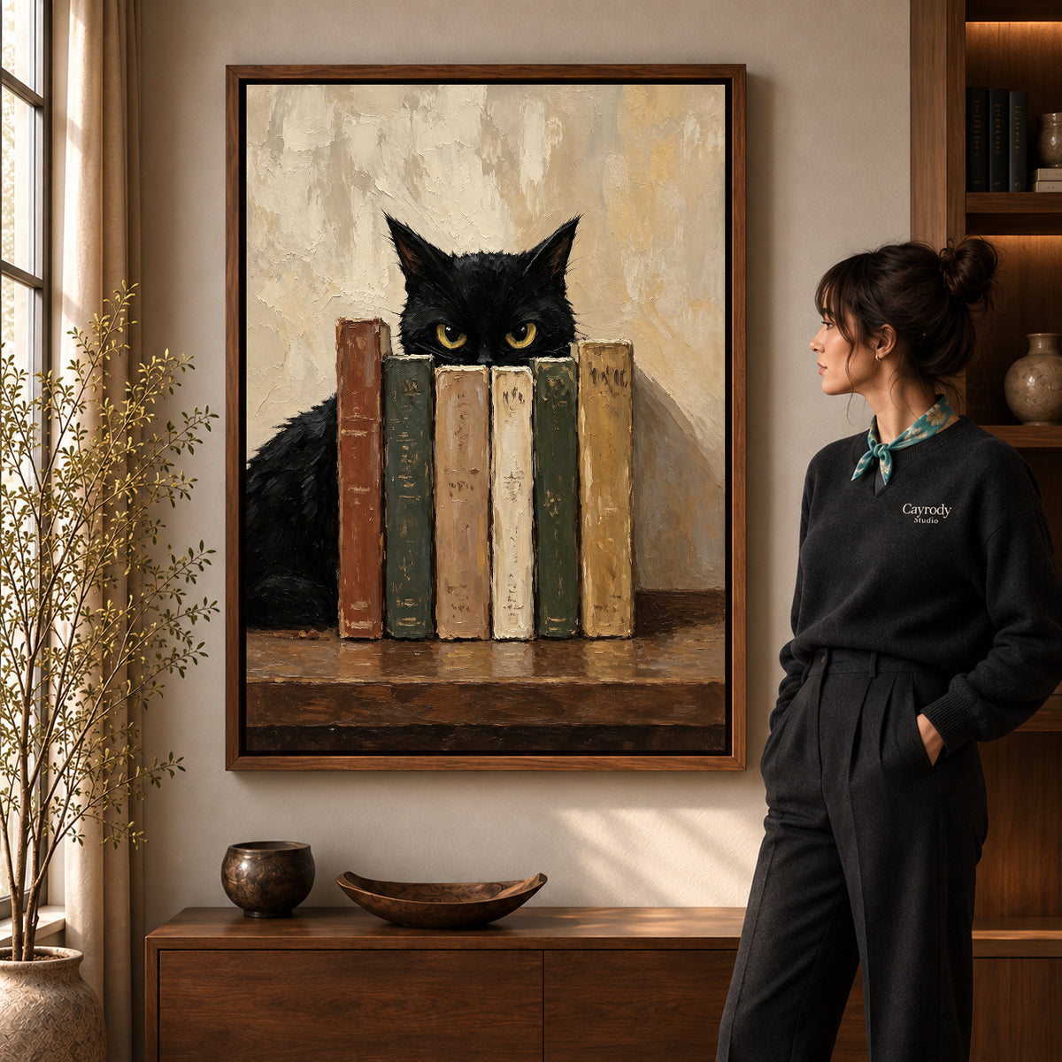Walnut framed bookish cat canvas art with the complete artwork displayed in a warm living room.