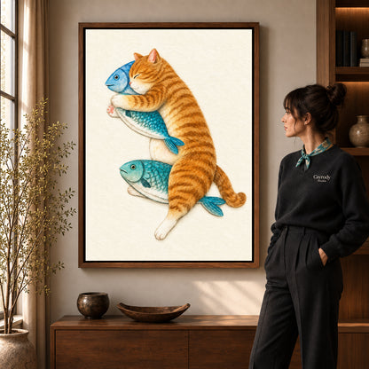 Orange Cat Canvas Art in a walnut frame beside a standing woman and warm wooden furniture.