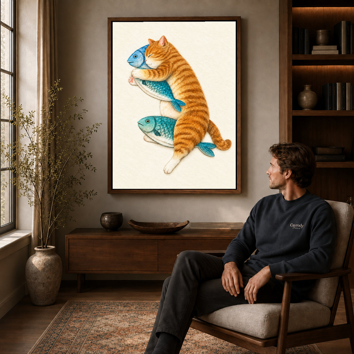 Orange Cat Canvas Art displayed in a walnut frame above wooden furniture beside a seated man.
