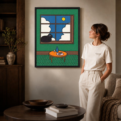 Black framed window cat canvas art displayed beside a woman with natural light across the wall.