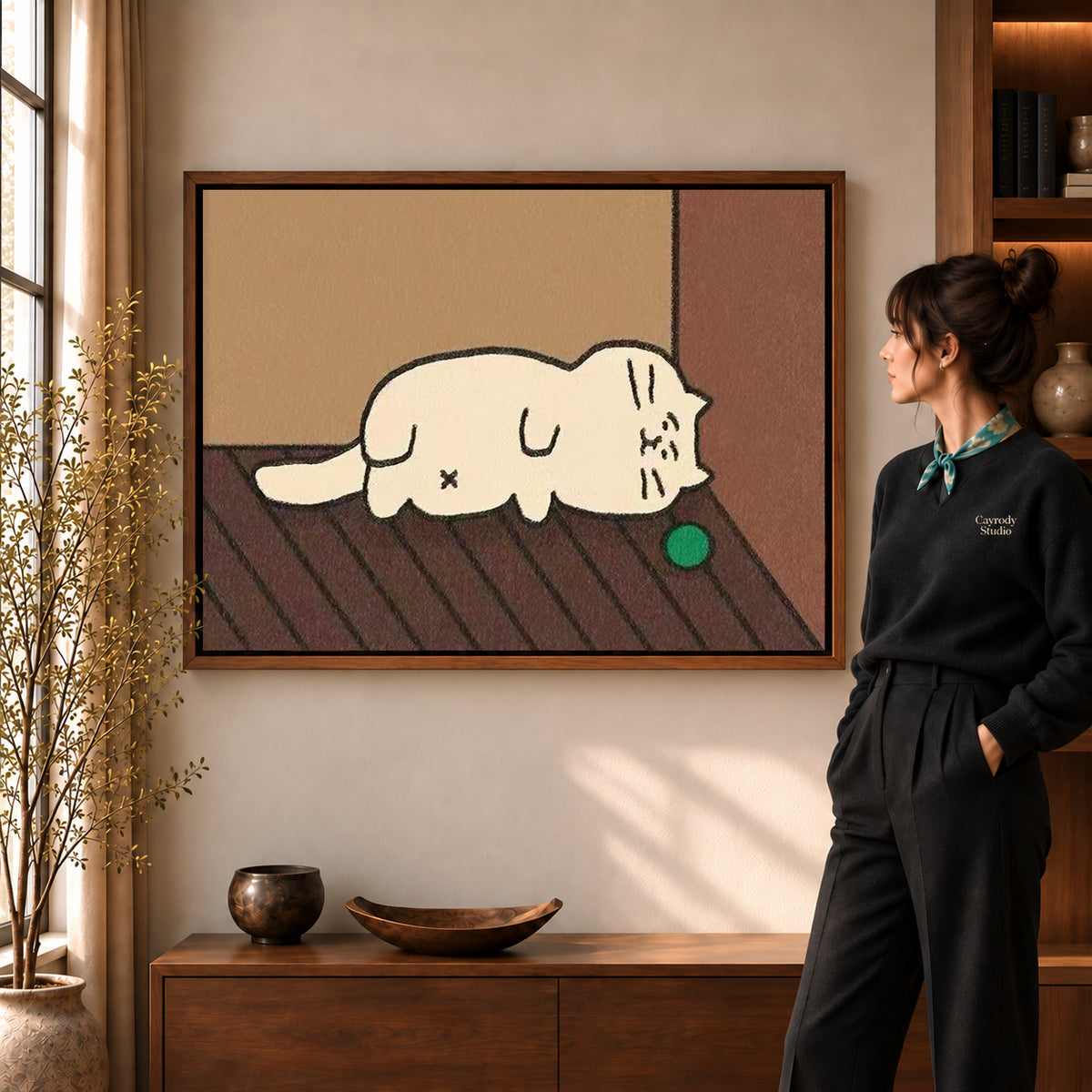 Walnut framed sleepy cat canvas art with the complete artwork displayed in a warm living room.