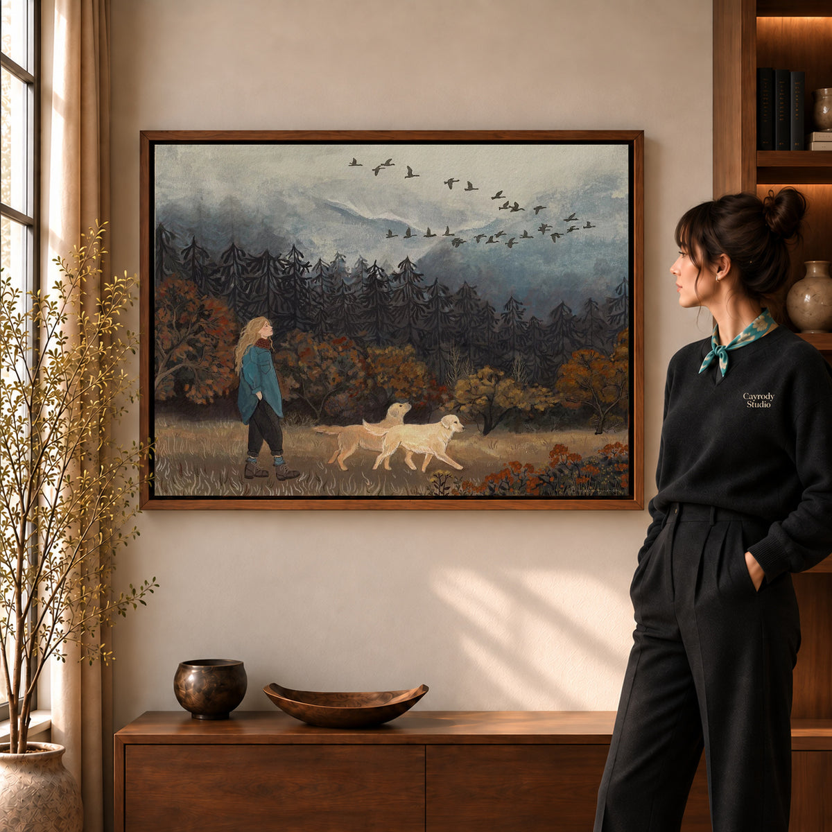 Walnut framed autumn dog walk canvas art with the complete artwork displayed in a warm living room.