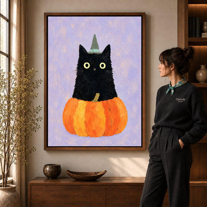 Pumpkin Witch Cat Canvas Art in a walnut frame beside a standing woman and warm wooden furniture.
