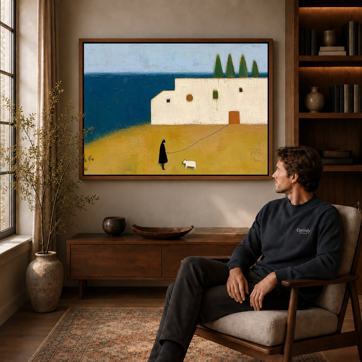 Coastal Companion Canvas Art displayed in a walnut frame above wooden furniture beside a seated man.