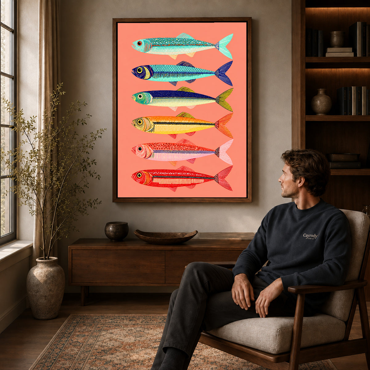 Colorful Sardine Canvas Art displayed in a walnut frame above wooden furniture beside a seated man.