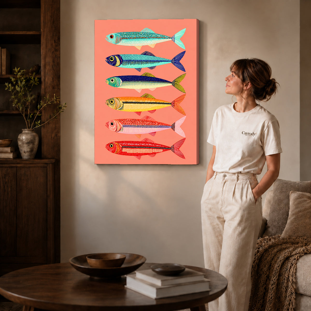Gallery wrapped colorful sardine canvas art showing dimensional edges and soft shadows in a living room.