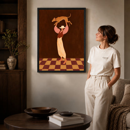 Black framed cowgirl dog canvas art displayed beside a woman with natural light across the wall.