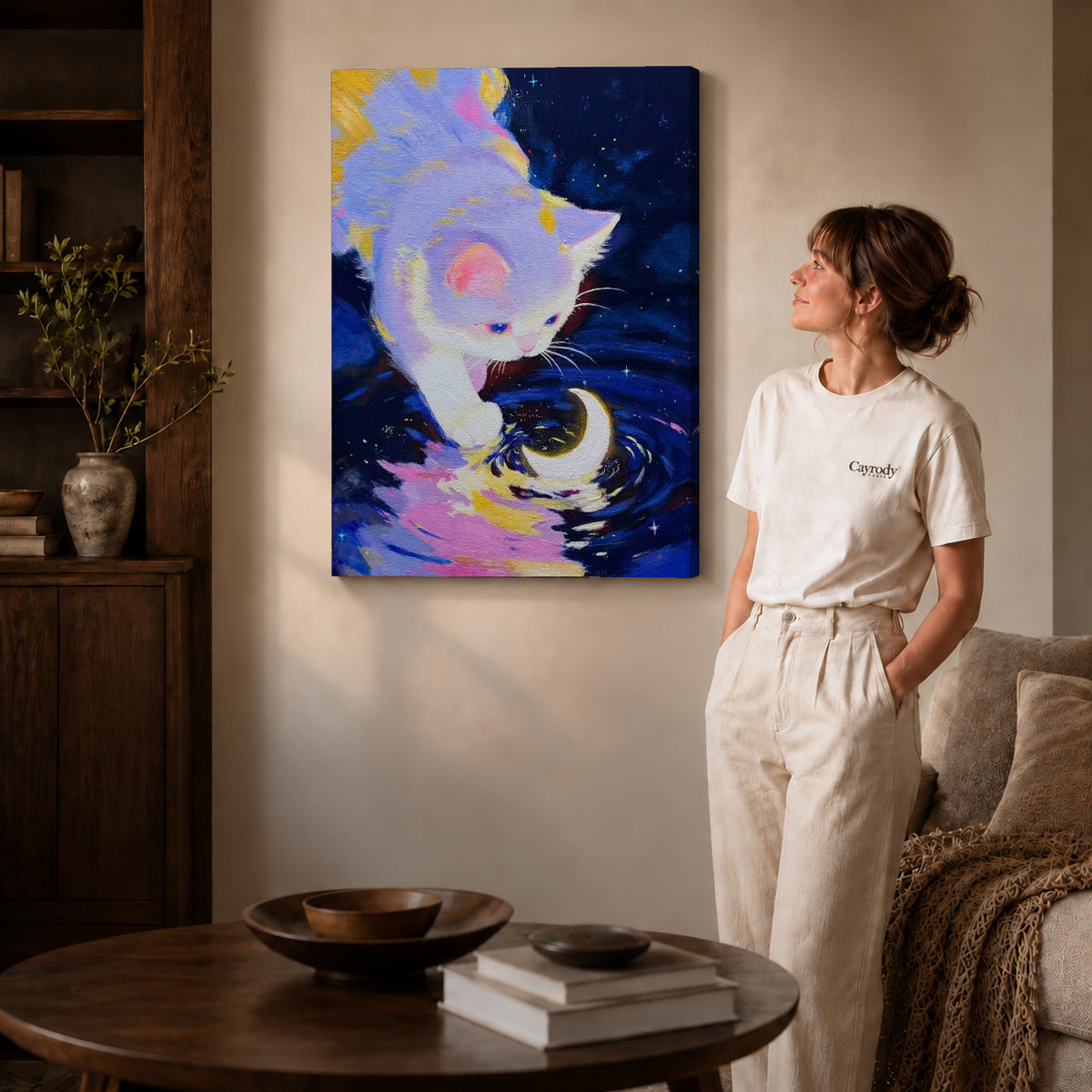 Moonlit Kitten Canvas Art on gallery wrapped canvas with visible depth beside a woman in white.