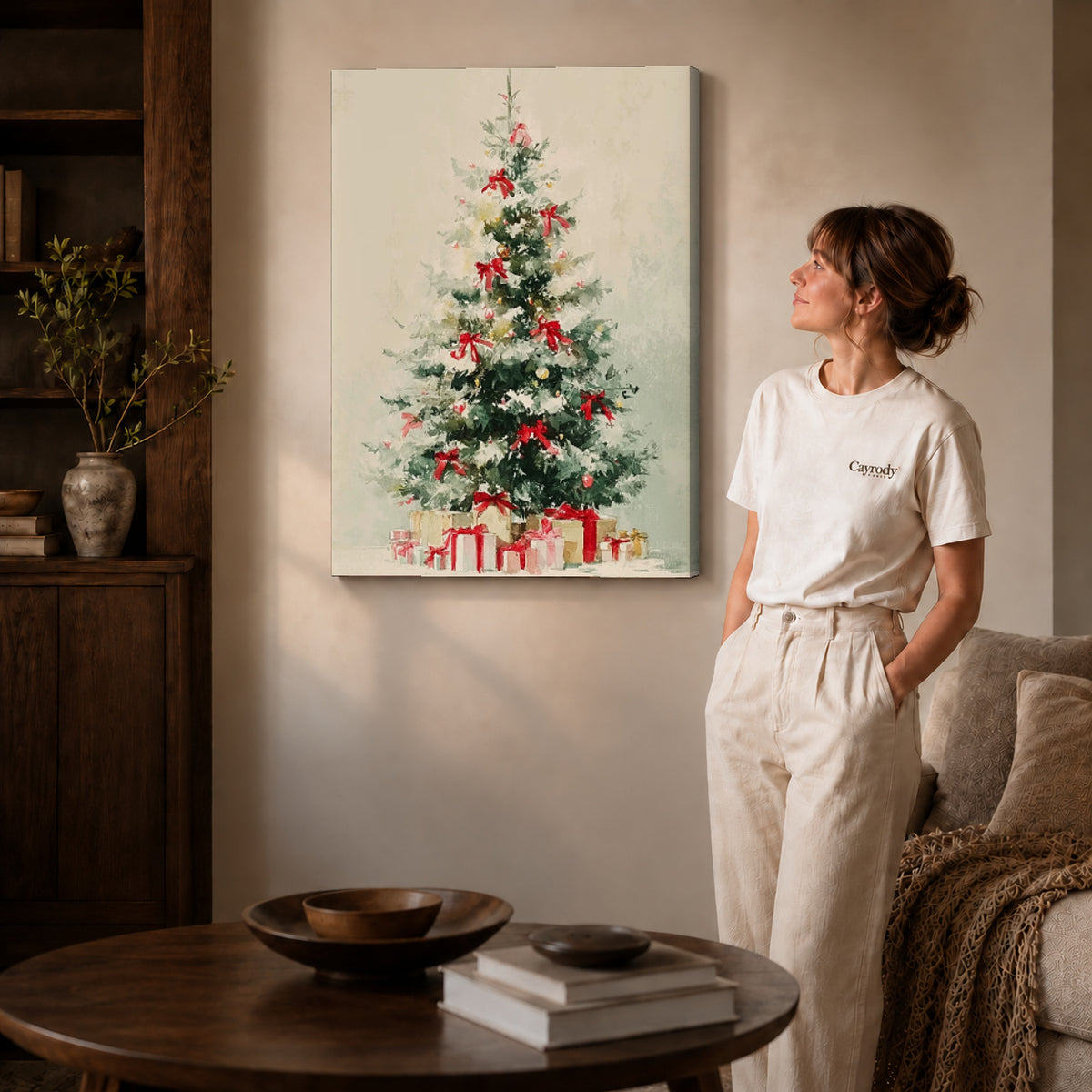 Snowy Christmas Tree Canvas Art on gallery wrapped canvas with visible depth beside a woman in white.