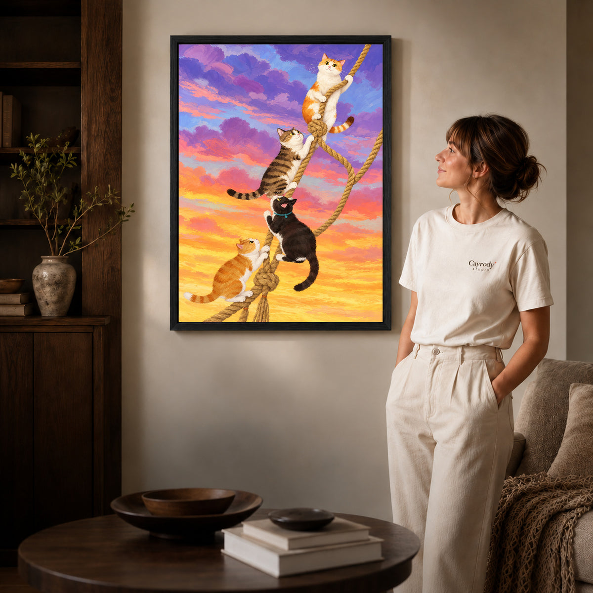 Black framed whimsical climbing cats canvas art room scene assigned to all six black framed canvas sizes.