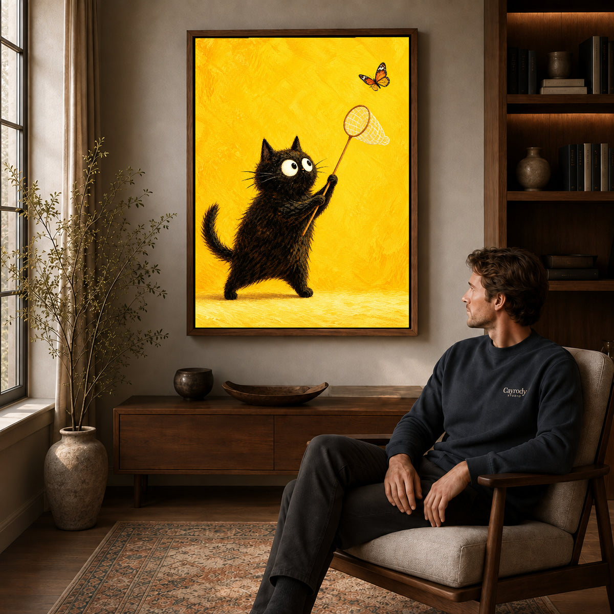 Walnut framed funny butterfly cat canvas art above a seated man in a cozy wood furnished living room.