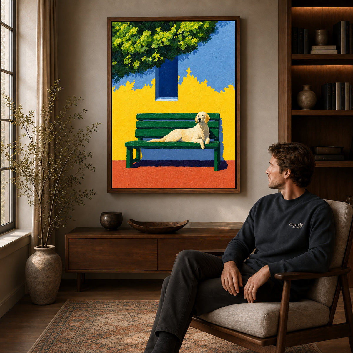 Walnut framed golden retriever bench canvas art above a seated man in a cozy wood furnished living room.