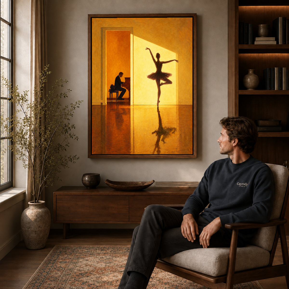 Walnut framed golden ballerina canvas art above a seated man in a cozy wood furnished living room.