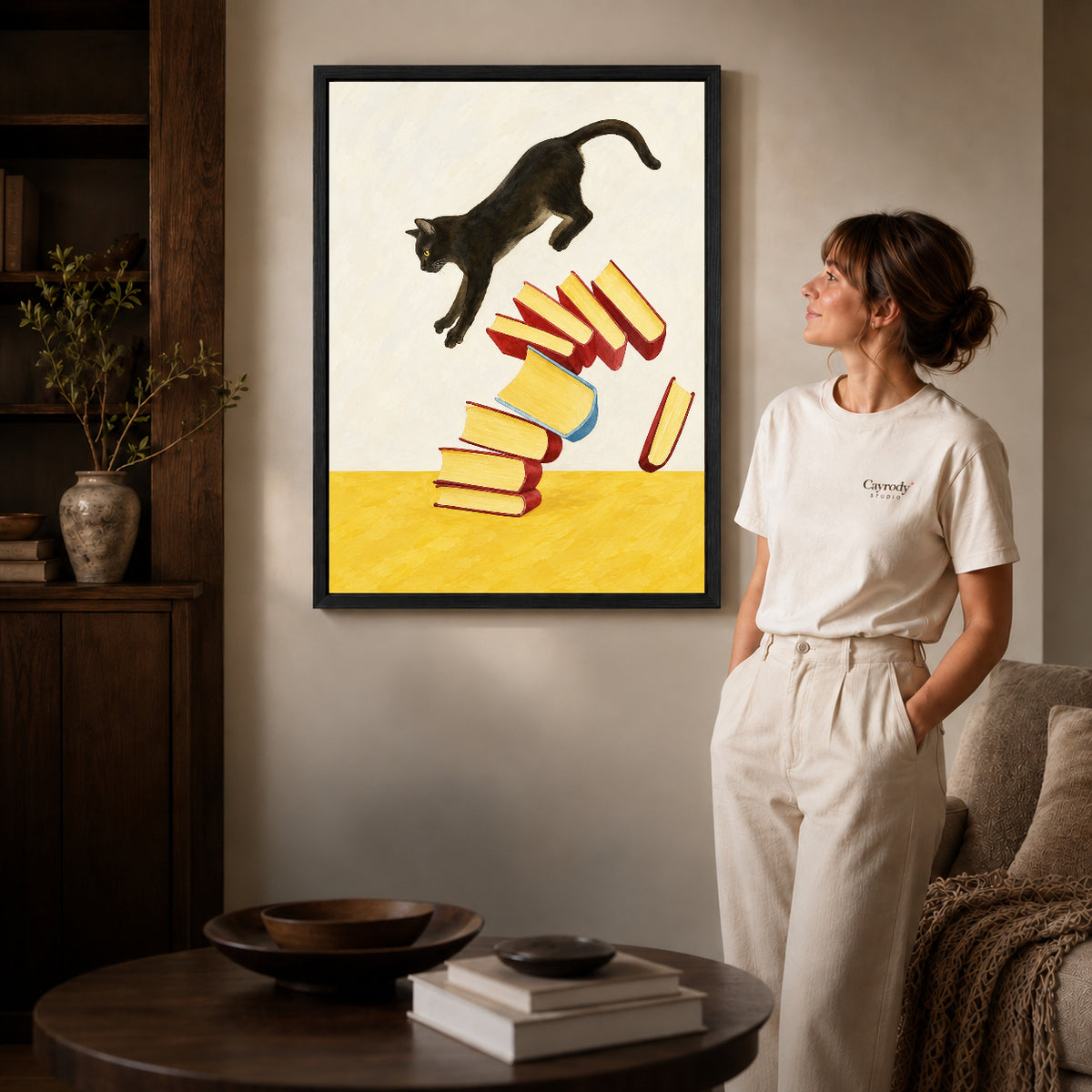 Black framed leaping cat books canvas art room scene assigned to all six black framed canvas sizes.