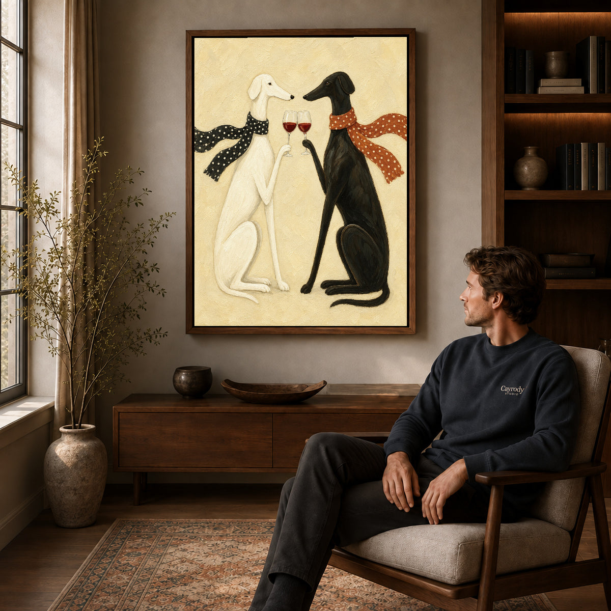 Walnut framed toasting greyhounds canvas art above a seated man in a cozy wood furnished living room.