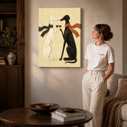Gallery wrapped toasting greyhounds canvas art with subtly shaded canvas edges beside a woman wearing cream clothing.