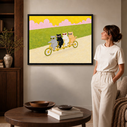 Black framed landscape tandem cycling cats canvas art room scene assigned to all six black framed canvas sizes.