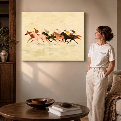 Gallery wrapped landscape galloping horse race canvas art with subtly shaded canvas edges beside a woman wearing cream clothing.