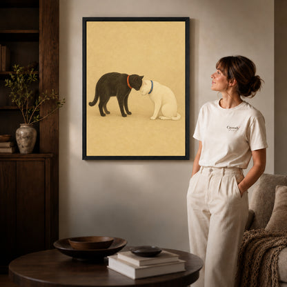 Black framed tender cat companions canvas art displayed beside a woman in a warm wood living room.