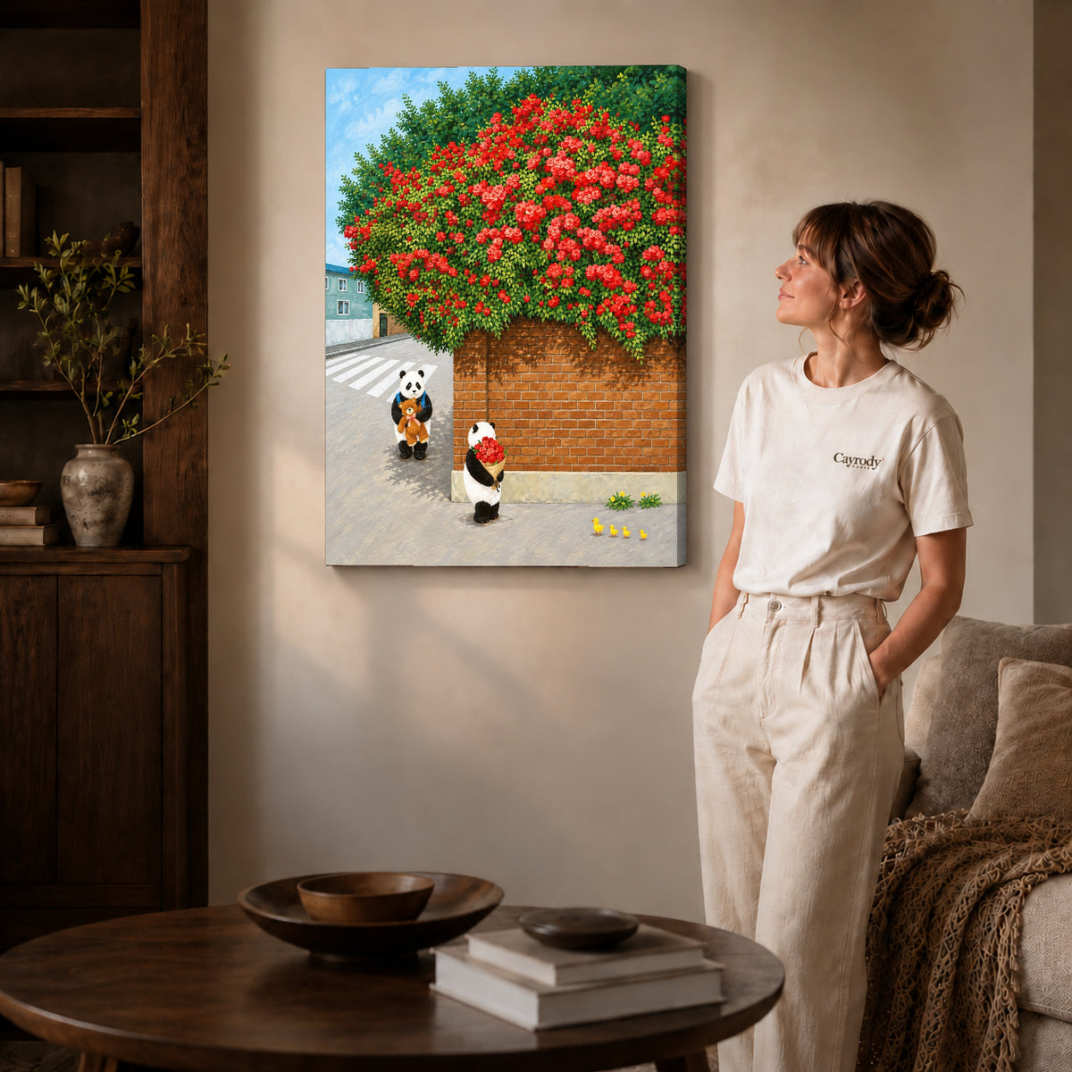 Gallery wrapped panda rose bouquet canvas art with subtly shaded canvas edges beside a woman wearing cream clothing.