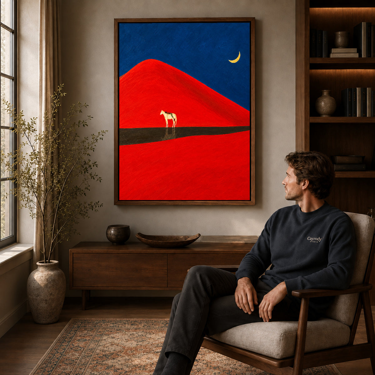Walnut framed red dune horse canvas art above a seated man in a cozy wood furnished living room.