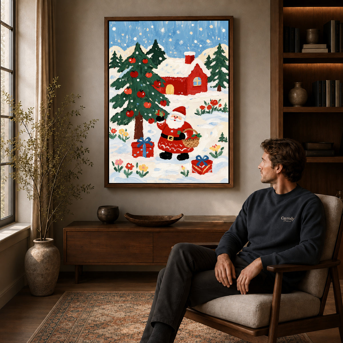 Folk Santa canvas art in a walnut frame above a console beside a seated man.