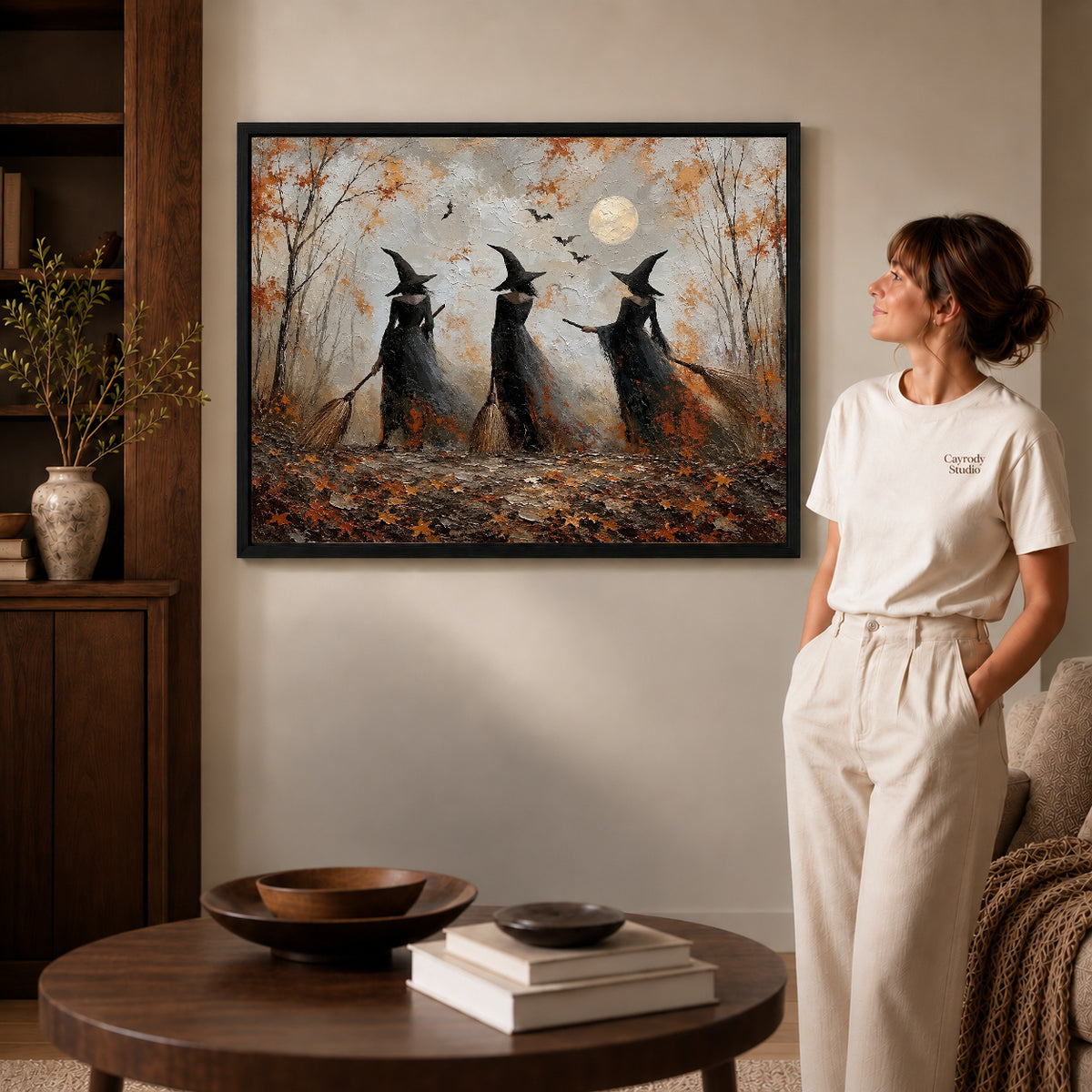 Woodland witches canvas art shown in the black frame option against a softly lit wall.