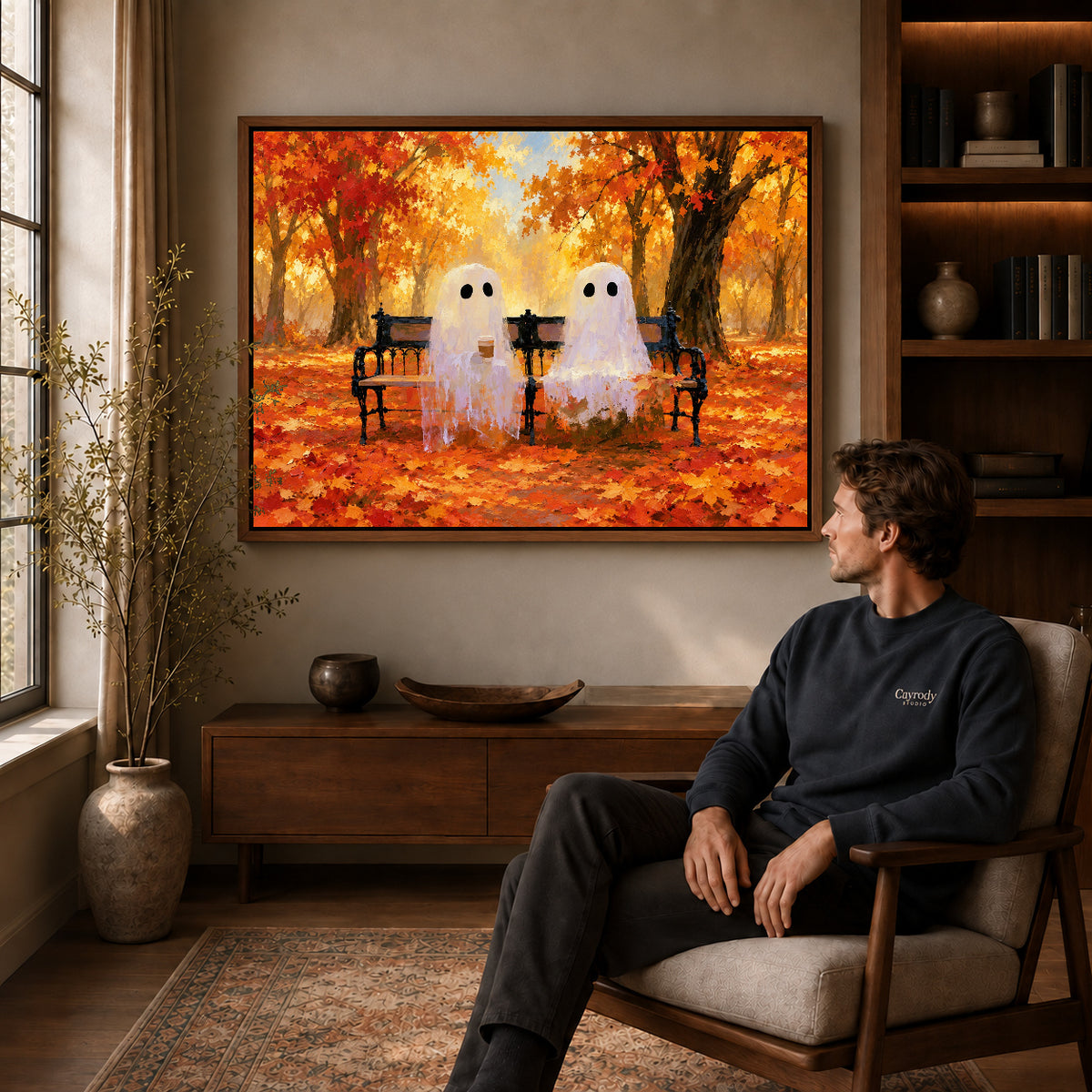 Bench ghosts canvas art in a walnut frame above a console beside a seated man.
