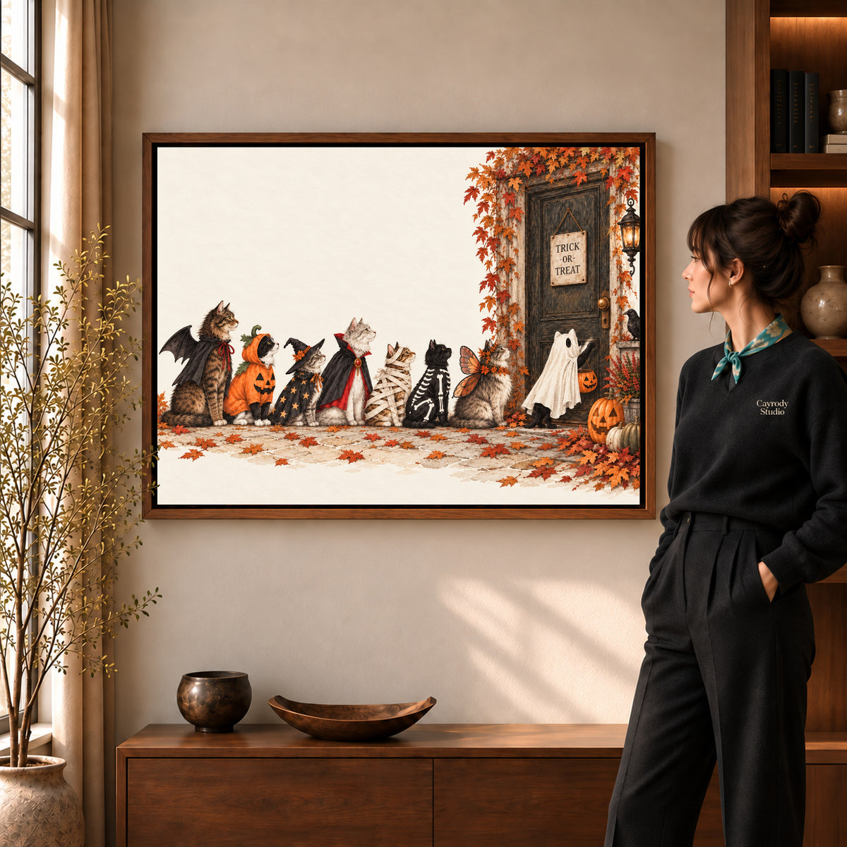 Halloween cat canvas art shown in the walnut frame option against a softly lit living room wall.