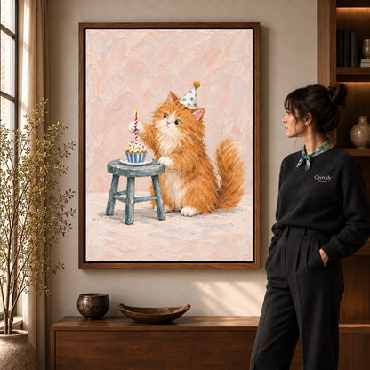 Birthday kitten canvas art in a walnut frame beside a standing woman and wooden console.