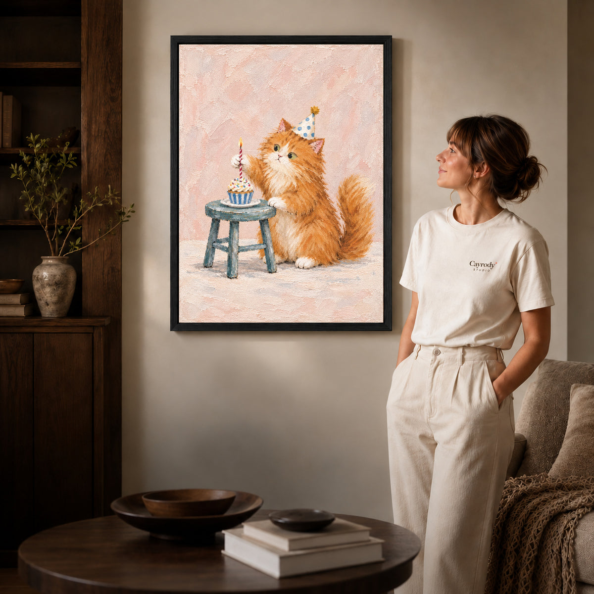 Birthday kitten canvas art shown in the black frame option against a softly lit wall.