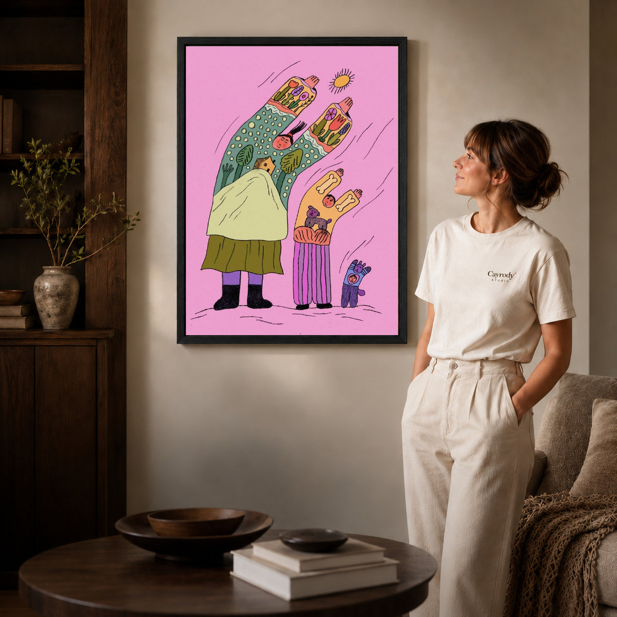 Folk family canvas art shown in the black frame option against a softly lit wall.