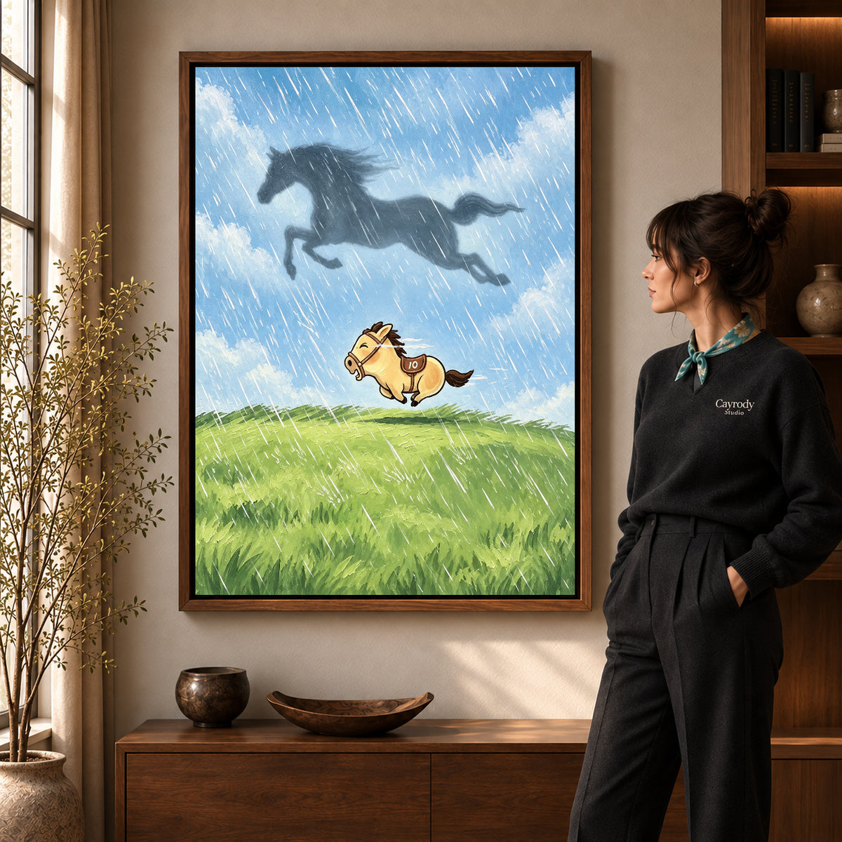Dreaming Pony canvas art in a walnut frame beside a standing woman and wooden console.