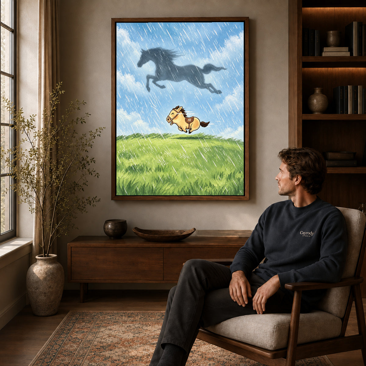 Dreaming Pony canvas art in a walnut frame above a console beside a seated man.