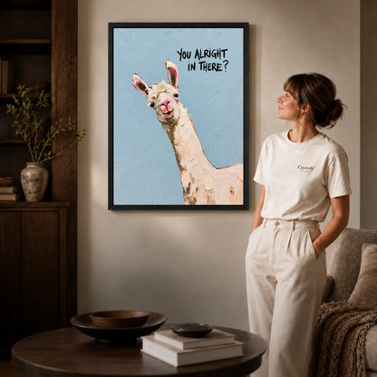 Curious llama canvas art shown in the black frame option against a softly lit wall.
