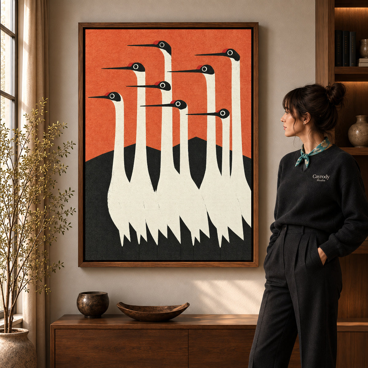Crane canvas wall art shown in the walnut frame option against a softly lit living room wall.