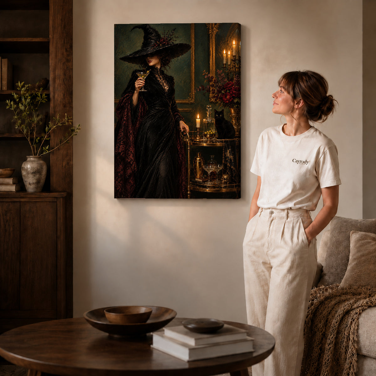 Gothic witch canvas art on gallery-wrapped canvas with visible edge depth beside a standing woman.