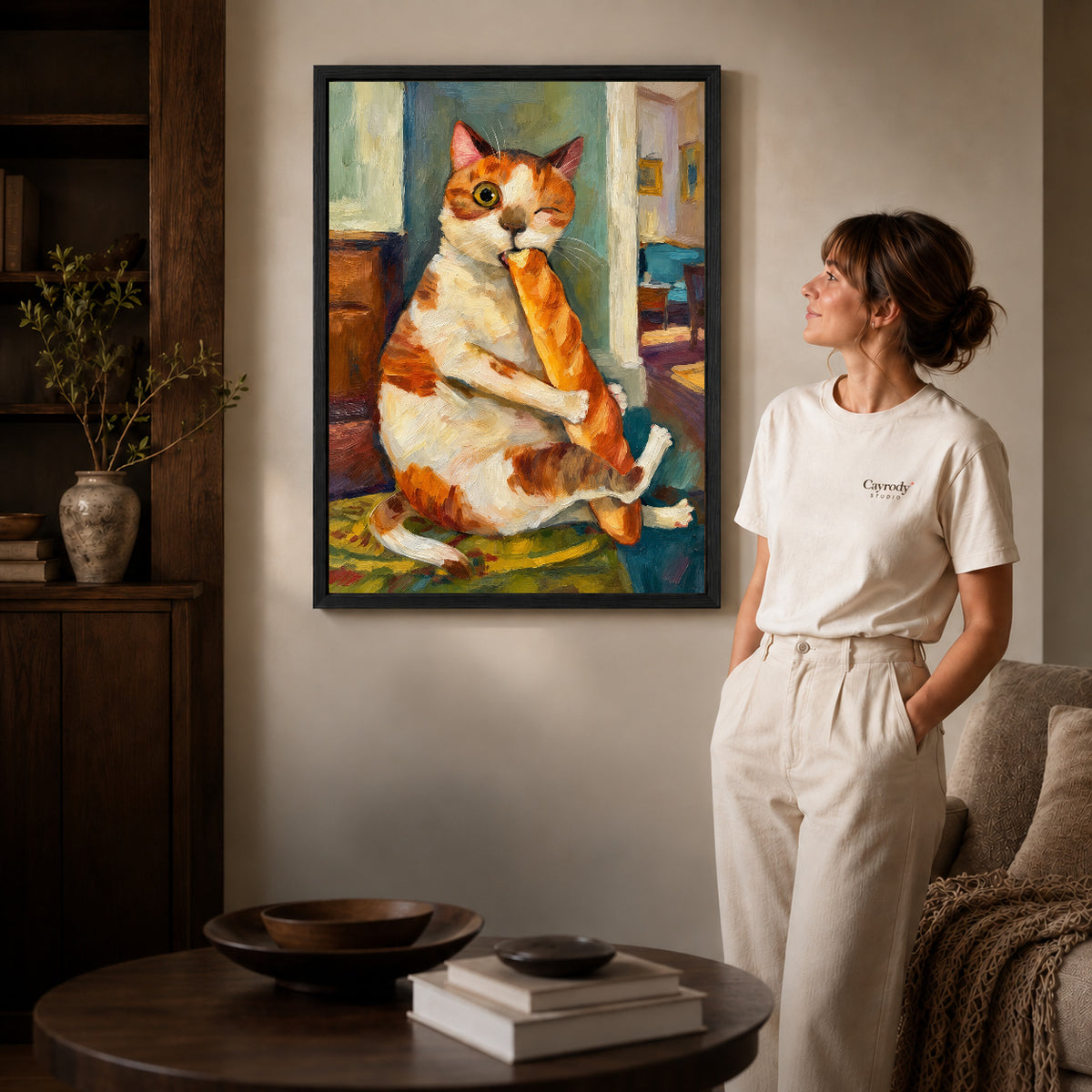 painterly baguette cat canvas art shown in the black frame option against a softly lit wall.