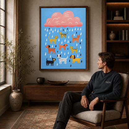 Raining pets canvas art in a walnut frame above a console beside a seated man.