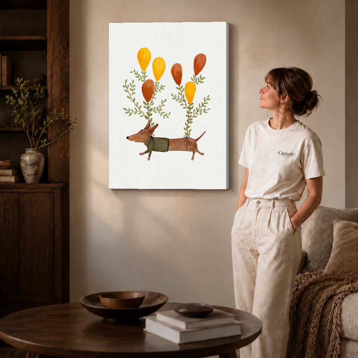 Balloon dachshund canvas art on gallery-wrapped canvas with natural edge shading beside a standing woman.